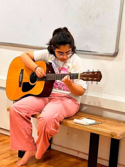 A student engrossed in her guitar practice at our new branch in Borivali, Mumbai. We are excited to bring our music, guitar, piano, and singing classes to more locations.