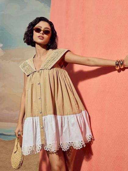 A close-up shot of the Sand Sailor Dress from Qala Clothing, highlighting the texture of the fabric and the detailed collar.