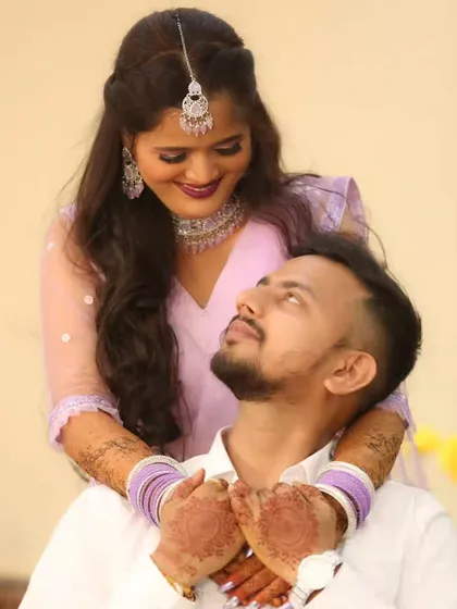 A romantic gaze between the couple, capturing a sweet, unscripted moment.
