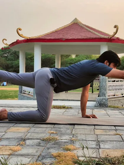 Here I am in Meru Dand Santulan Asana, the Spine Balancing Pose. This pose is excellent for improving balance and stability while strengthening the core, arms, and legs simultaneously.
