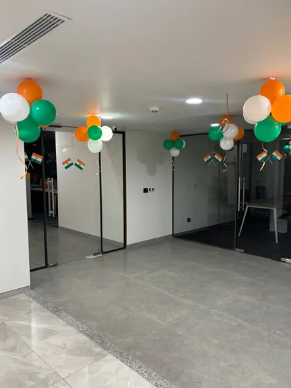 Another view of the office space, showing how balloon bunches and small Indian flags were used to decorate hallways and cabin entrances. It’s a simple way to bring the celebration to every corner of the office.