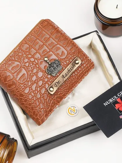 This tan crocodile leather wallet is personalized with a crown charm and a 'Dr.' title, making it a great gift for a doctor.