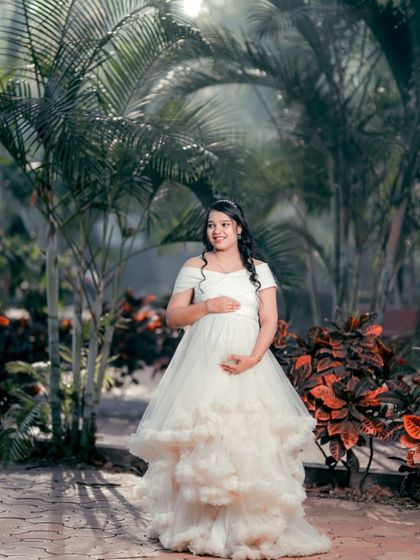 Another look at the angelic white ruffled gown, this time with beautiful backlighting that makes the dress glow. It's perfect for creating a magical, ethereal vibe.