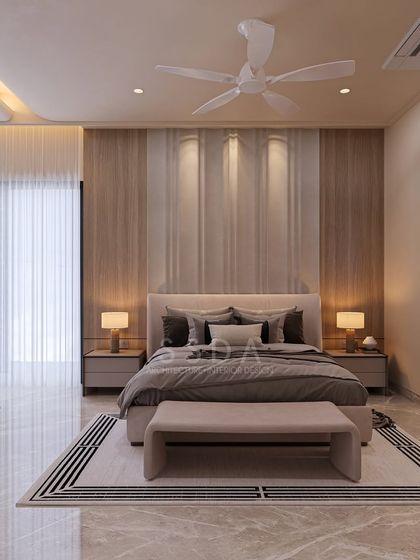 This farmhouse villa bedroom is a serene retreat with its soft beige tones and clean white furniture. The headboard wall is accented with vertical wood veneer panels and soft lighting, adding warmth and texture.