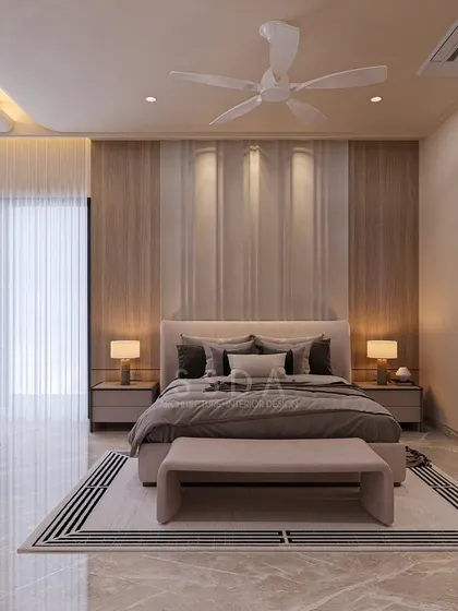 This farmhouse villa bedroom is a serene retreat with its soft beige tones and clean white furniture. The headboard wall is accented with vertical wood veneer panels and soft lighting, adding warmth and texture.