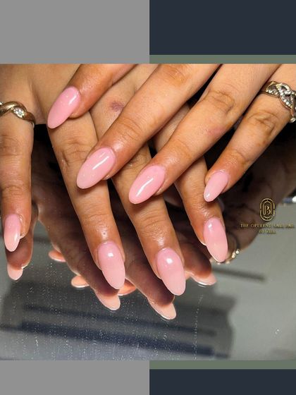 A little gloss, a lot of elegance. These sheer pink almond nails are perfect for an effortlessly polished look.