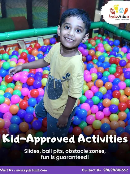 Look at that smile! My indoor play area is packed with kid-approved activities, including this giant, colorful ball pit that guarantees hours of fun. It's a safe and exciting space where kids can just be kids.