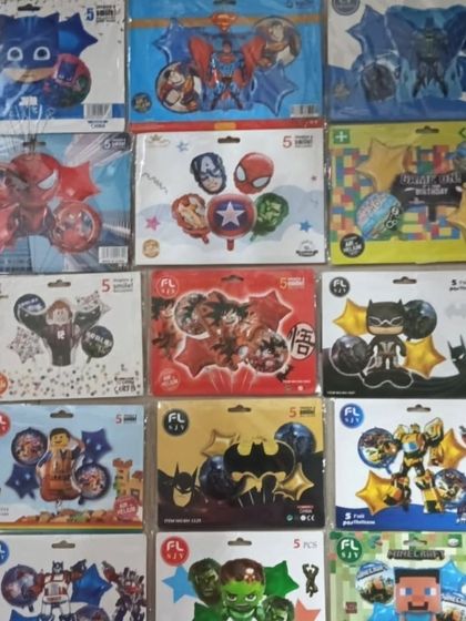 A selection of foil balloon sets for popular superhero and cartoon themes, including Batman, Superman, The Avengers, and Minecraft.