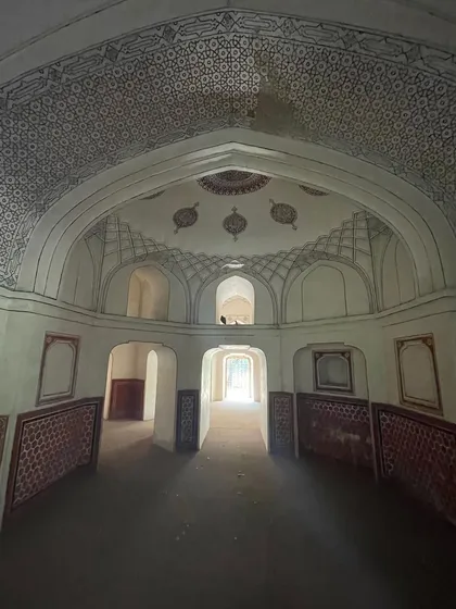 The stunningly restored ceiling of a tomb in Sunder Nursery, with intricate incised plaster and painted patterns. This demonstrates the high level of artistry in Mughal decoration.