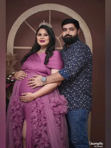 A classic, happy couple's portrait. They are both looking at the camera, sharing their joy with the world. The crown and gown make it an extra special memory.