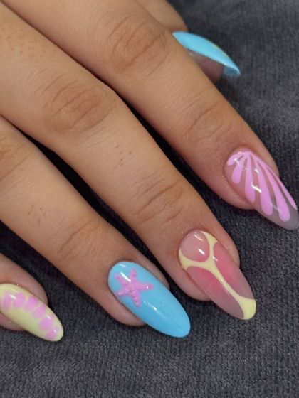 Getting ready for a beach vacation? This set is perfect, with hand-painted starfish, shells, and water-inspired patterns in a pastel palette.