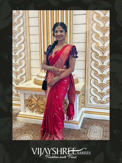 Siri looking radiant in a classic red Banarasi silk saree, a perfect choice for wedding celebrations.