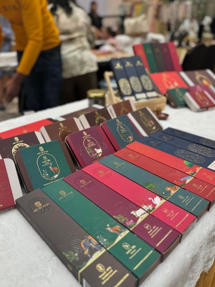 A close-up of the colourful and elegant packaging for 'Art of Puja' products, showing the quality of brands we host.