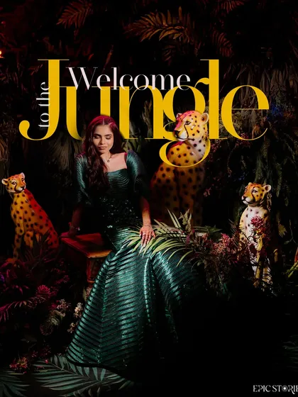 A fun and thematic shot from a 'Welcome to the Jungle' themed party. The bride, Diksha, looks stunning and powerful, perfectly embodying the wild and glamorous vibe of the evening.