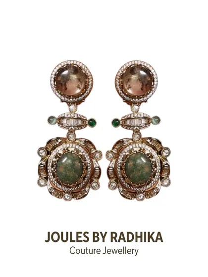 Drama in every curve. These couture earrings, worn by Anushka Sen at Cannes, feature a unique design with semi-precious stones and intricate polki work.