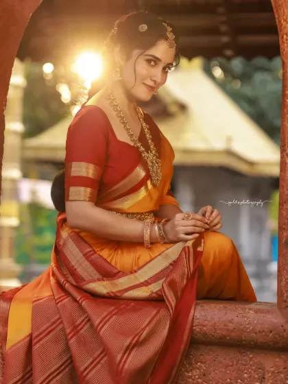 A stunning portrait taken at golden hour. The warm light illuminates the bride and her surroundings, creating a magical and romantic atmosphere.
