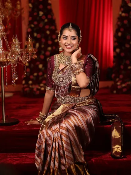 A candid moment of the bride, her expression full of happiness and anticipation.