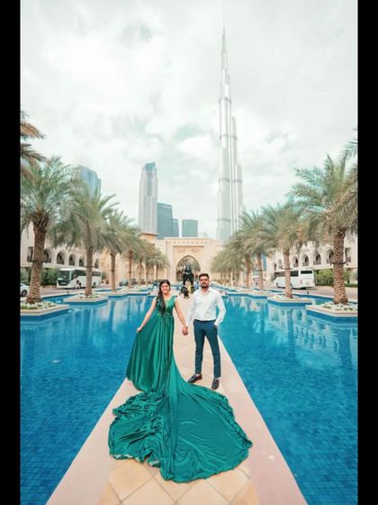 A stylish pre-wedding photo in front of the fountains in Dubai. Our global presence makes us the go-to choreographers for couples planning destination weddings.