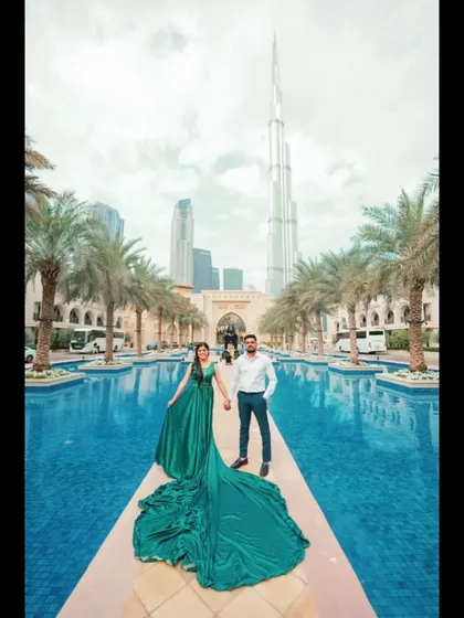 A stylish pre-wedding photo in front of the fountains in Dubai. Our global presence makes us the go-to choreographers for couples planning destination weddings.