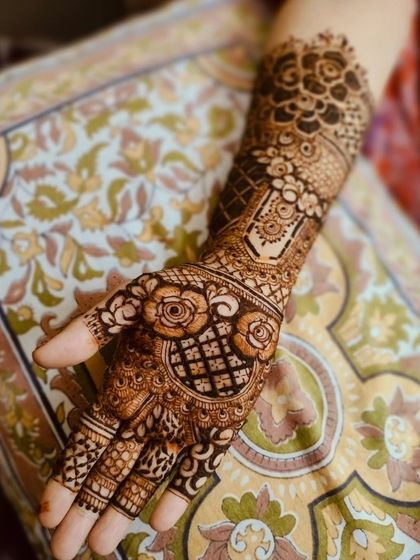 A single-hand shot showing the detail of this semi-bridal design. The rose motifs are a central feature of this pattern.