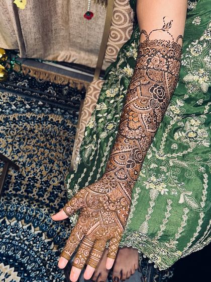 A full view of the arm, showcasing the beautiful flow of the design from the wrist to the elbow.