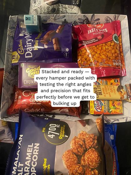 The art of packing. Every hamper is carefully stacked to ensure it looks perfect and travels safely, especially when we're dealing with large quantities.