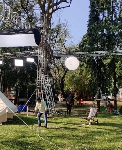 A complex outdoor lighting rig for a TV commercial, blending a variety of modern LED fixtures including Nanlux Dyno and Evoke lights, a Lightstar Airlite, and Arri SkyPanels, all controlled wirelessly for maximum flexibility.