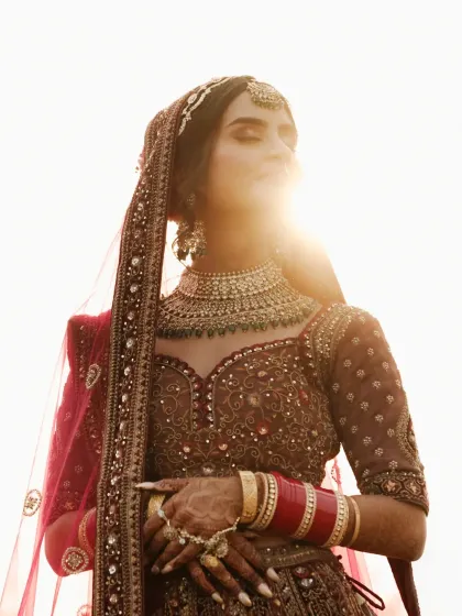 A bride bathed in the golden light of the sun, a moment of quiet reflection before she steps into her new life. My bridal portraiture is about capturing this inner radiance and timeless elegance.