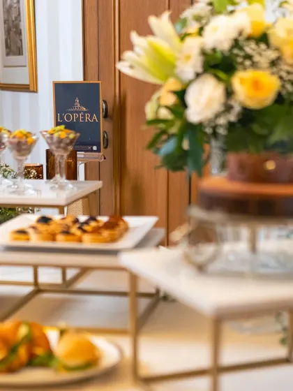 A glimpse of the elegant setup for our L'Opéra collaboration, with their iconic branding in the background. It's an honor to partner with such a respected name in patisserie.