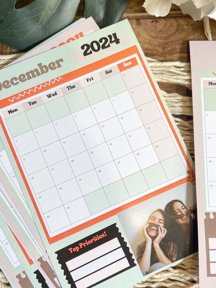 A stack of planner calendar pages for 2024, showing the clean and functional design. You can add your own photos to make planning your month more personal.