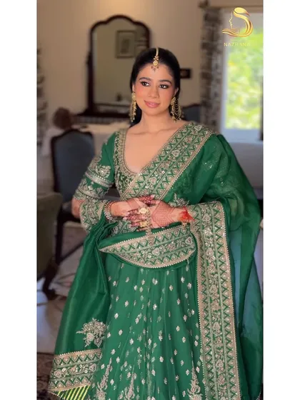 My beautiful bride in her green Torani outfit, her gajra hairstyle looking absolutely perfect.