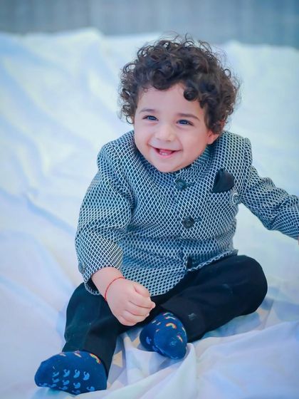 A happy moment captured. This little boy's joyful expression says everything about how comfortable and special he feels in his Vern Kids outfit.