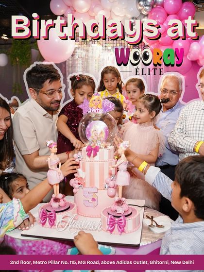 A joyful cake-cutting moment at a Barbie-themed birthday party. The whole family gathers around the stunning themed cake to celebrate the special day.