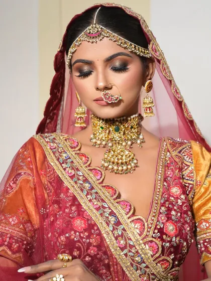 This shot showcases the beautiful smokey eye makeup with lids closed. It's a great way to see the detail and blending that goes into creating a dramatic eye look.