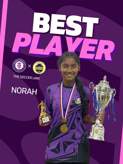 Norah, named Best Player of the U17 tournament, holding her trophy and medal with pride.