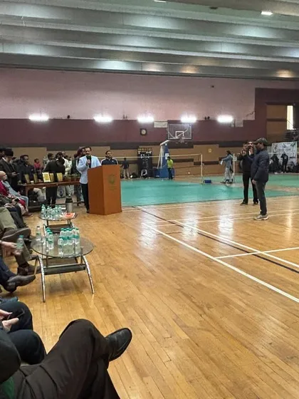 A wide shot of the opening ceremony for the Inter-Faculty tournament inside the sports complex. This shows the scale of the event and our ability to manage a large gathering of students and faculty.