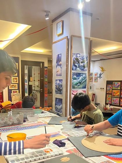 My studio is a place for ambitious projects. Here, older students are tackling large-scale paintings, showcasing the skills they've developed over time.