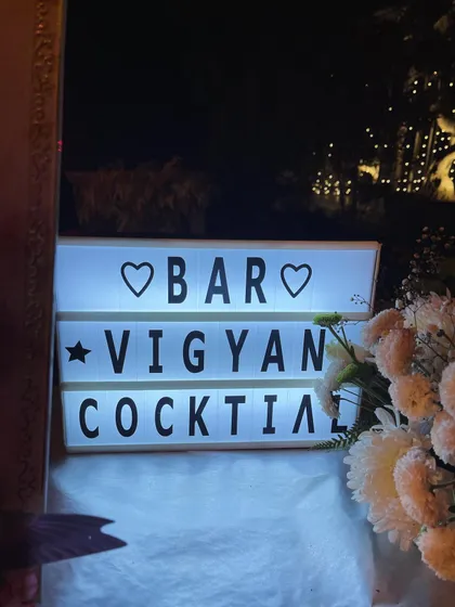 A simple yet charming detail from a birthday party bar setup. This light-up sign adds a personal touch and helps guide guests to the cocktail station.