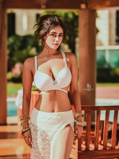 For this high-fashion swimwear shoot, the focus was on creating a bold and confident look. The clean lines of the white two-piece contrast with the warm, natural setting, resulting in a striking and modern fashion statement.