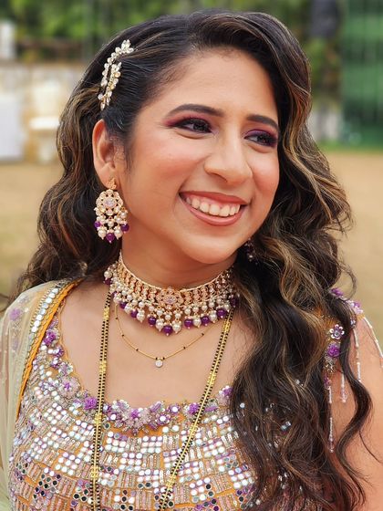 Reception glam with a touch of retro. I created this look with classic Hollywood waves and my favorite purple smokey eyes for a style that is both timeless and modern.