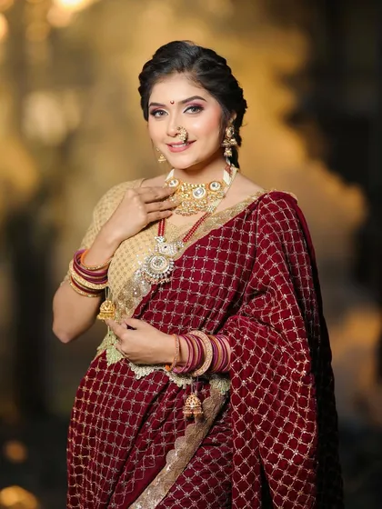 The complete look, highlighting the beautiful velvet saree and traditional gold jewelry. We aim to create looks that are both authentic and feel modern.