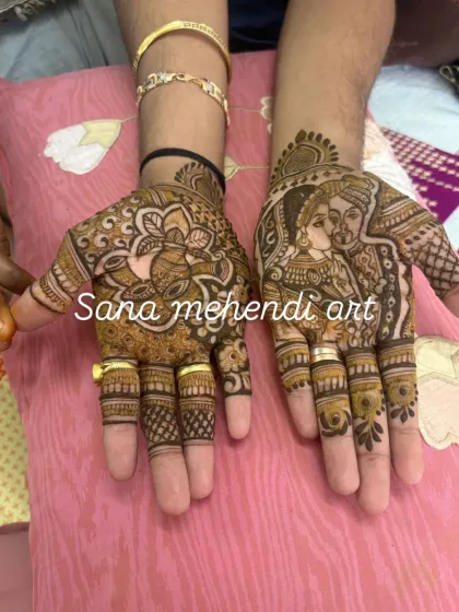 A sweet couple portrait on the groom's hand, showing that detailed and personal designs are a wonderful option for grooms too.