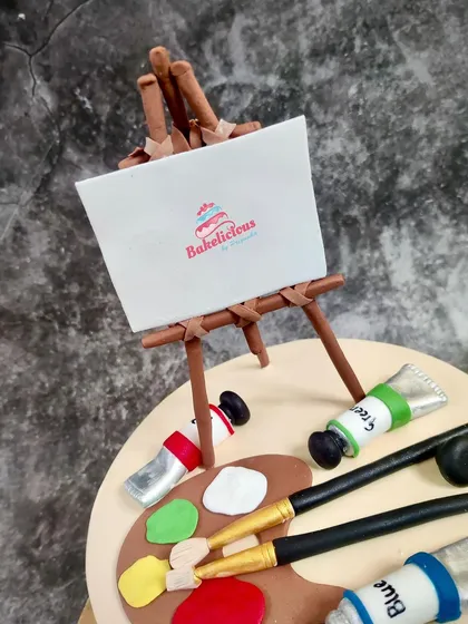 I even added my own little logo to the edible canvas on this artist-themed cake.