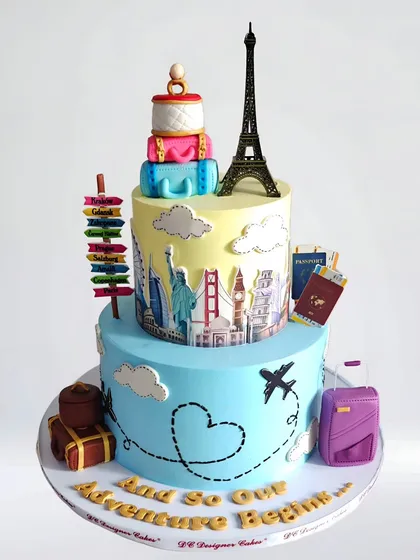 A travel-themed engagement cake for a globetrotting couple. This two-tier cake features landmarks from around the world, a passport, and an Eiffel Tower topper, symbolizing their adventures to come.