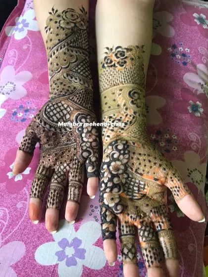 A gorgeous example of a completed order, with two different but complementary designs on each hand. This is a common request for party mehendi.