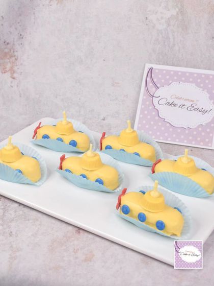 A platter of the yellow submarine mini cakes. These individual treats are perfect for dessert tables and party favors.