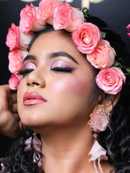 A serene close-up showcasing the delicate pink eyeshadow and glossy lips. This look is perfect for a bride who wants something soft, romantic, and modern.