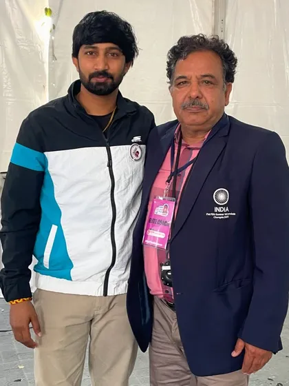 With a senior official from the Indian Olympic Association. Building relationships with key figures in the sports administration helps me create better opportunities for my athletes.