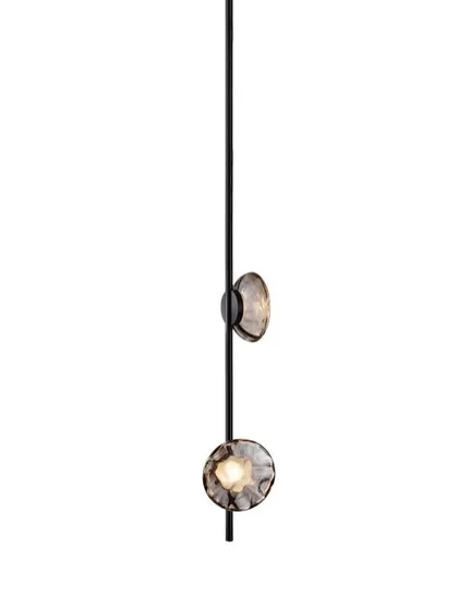 A studio shot of a vertical Ceto lamp with a black aluminum body, highlighting its sleek and modern profile.