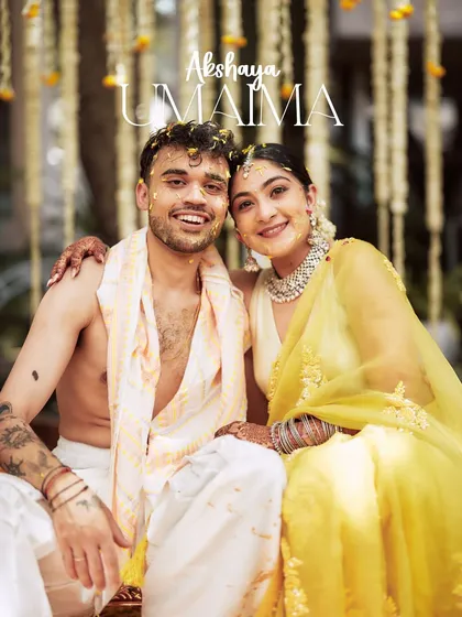 A happy portrait of the couple at their Haldi ceremony. Their smiles are infectious, and the traditional decor provides a beautiful, authentic setting.